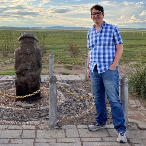 Griffin Creech in Khentii, Mongolia Griffin with an ancient burial marker during a research trip in Khentii province, eastern Mongolia, 2022